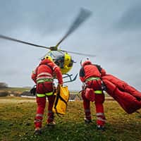 Two paramedic with safety harness and climbing equipment