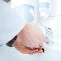 A person washing their hands