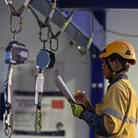 Auditor Wearing Safety Helmet Inspecting Fall Restraint Equipment