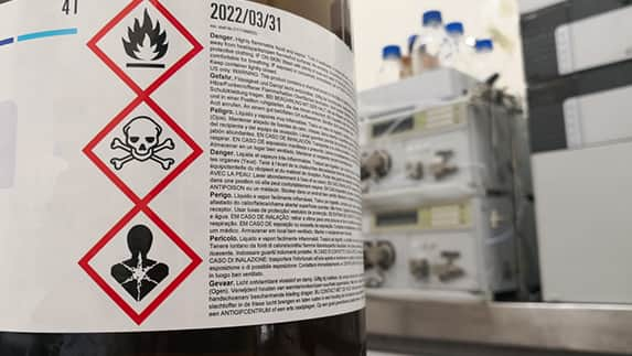 A bottle prominently displaying a label that displays warnings.